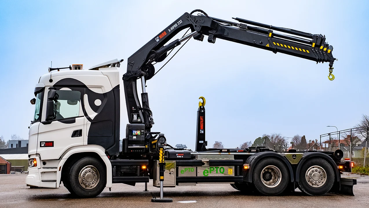 Loader crane unloading pallets from a truck in Berkhamsted